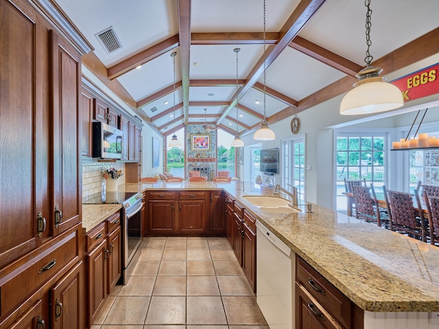 kitchen featuring appliances with stainless steel finishes, hanging light fixtures, light tile flooring, lofted ceiling with beams, and sink