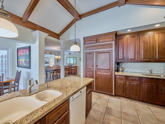 kitchen featuring lofted ceiling with beams, decorative light fixtures, white dishwasher, sink, and tasteful backsplash