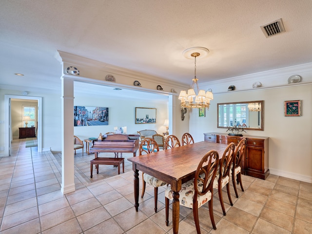 dining room featuring a textured ceiling, light tile flooring, a chandelier, and ornamental molding