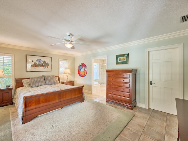 tiled bedroom featuring ornamental molding, ensuite bath, ceiling fan, and a textured ceiling