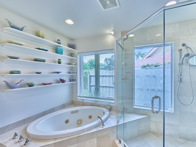 bathroom with a shower with door