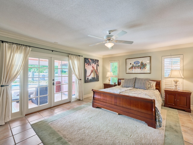 bedroom with ceiling fan, access to outside, light tile floors, and multiple windows