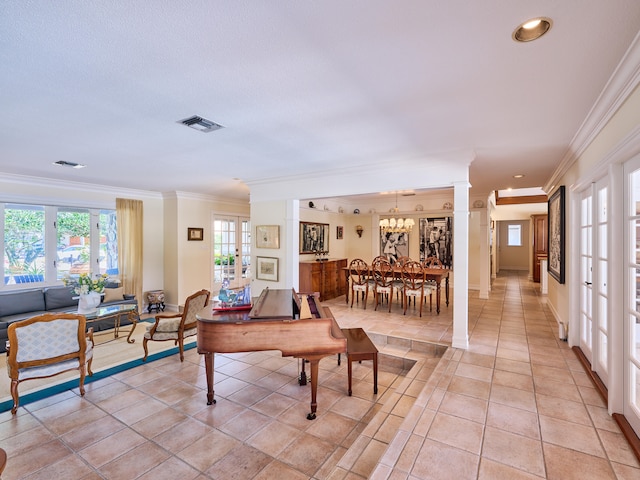 tiled living room featuring french doors, crown molding, and decorative columns