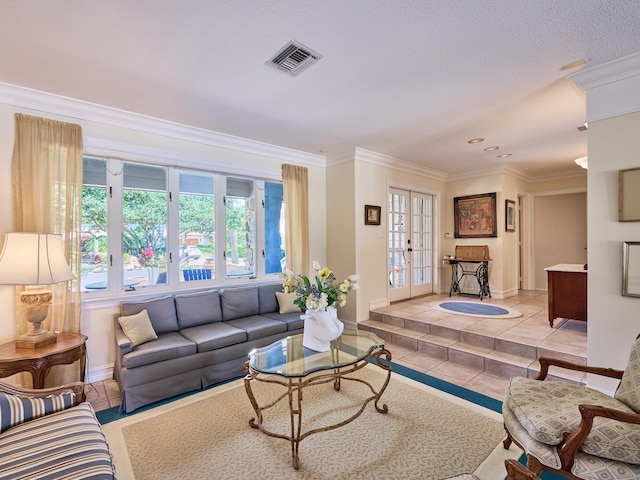 living room with crown molding and light tile floors