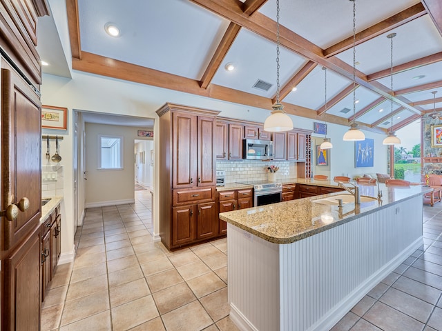 kitchen with light tile floors, lofted ceiling with beams, backsplash, hanging light fixtures, and stainless steel appliances