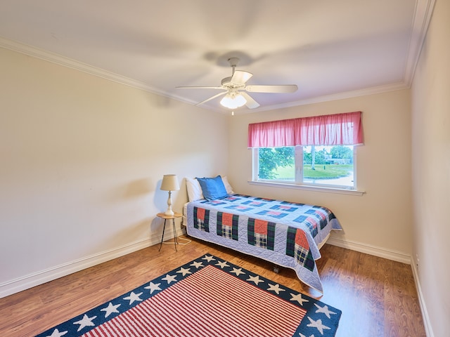 bedroom featuring crown molding, ceiling fan, and dark hardwood / wood-style floors