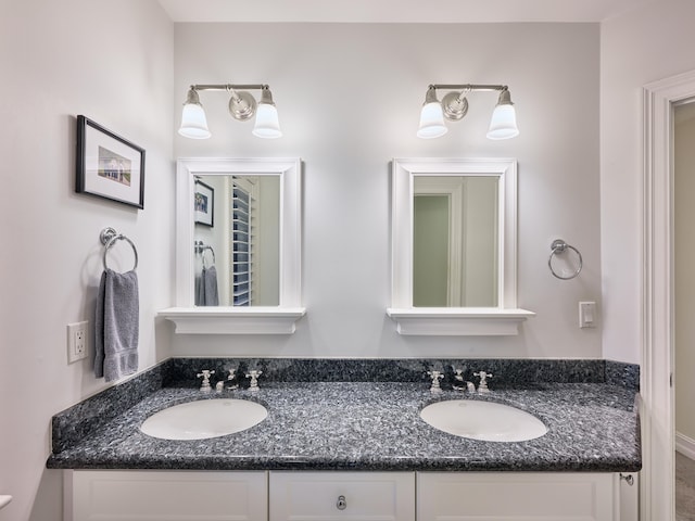 bathroom featuring double vanity