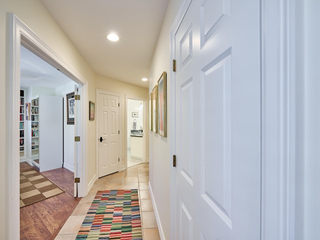 hall with light tile flooring