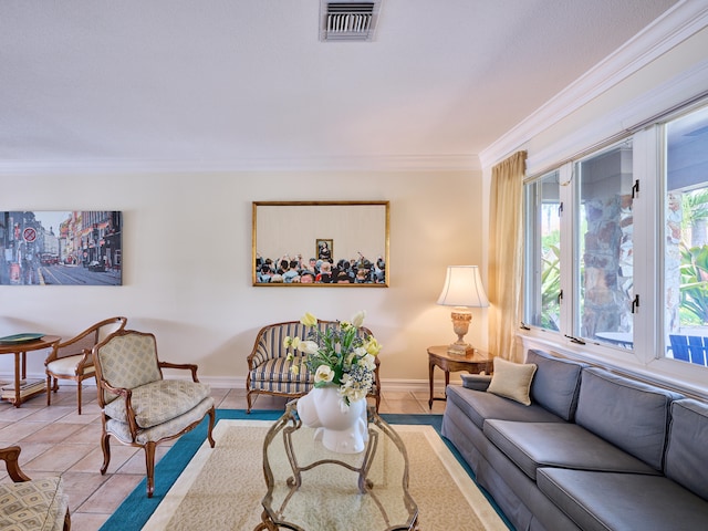 living room featuring ornamental molding and light tile floors