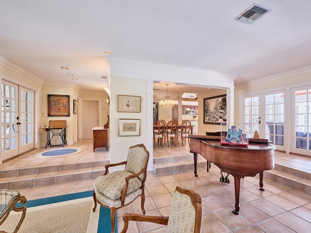 tiled office with a textured ceiling, french doors, crown molding, and a chandelier