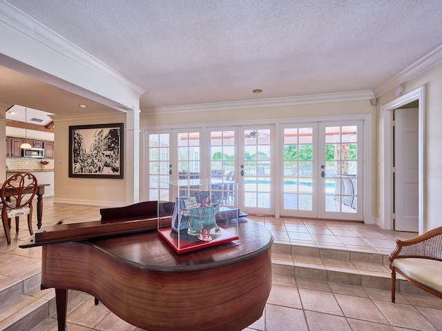 interior space featuring french doors, ornamental molding, and a textured ceiling