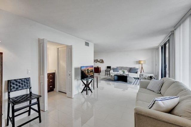 living room featuring light tile flooring