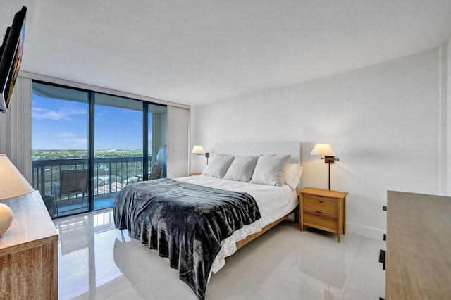 bedroom with floor to ceiling windows, access to exterior, and light tile floors