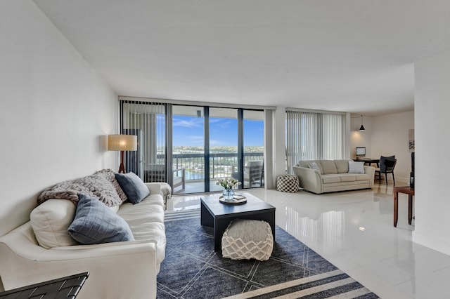 tiled living room featuring expansive windows