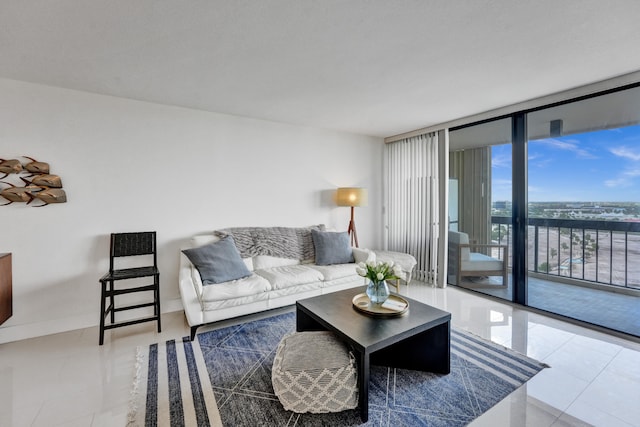 tiled living room featuring a wall of windows