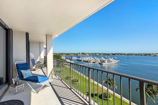 balcony featuring a water view