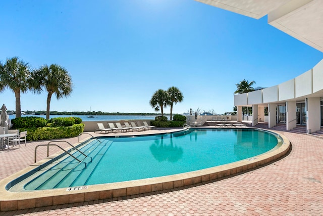 view of swimming pool with a patio area