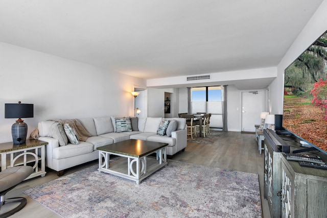 living room with dark wood-type flooring