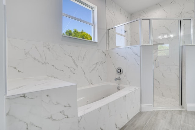 bathroom featuring separate shower and tub and tile floors