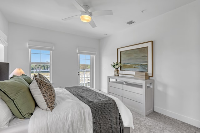 bedroom with ceiling fan, visible vents, baseboards, and carpet floors