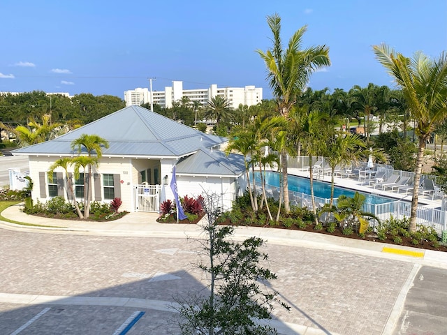 view of building exterior with a community pool