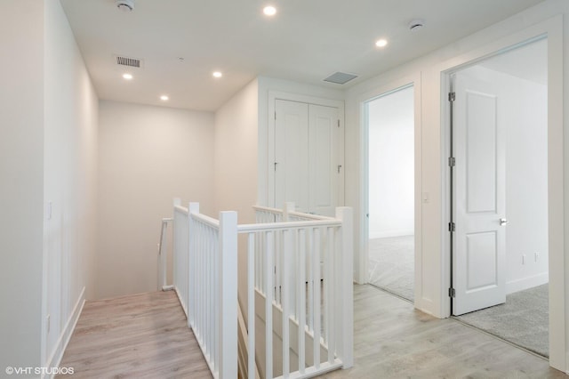 corridor featuring light hardwood / wood-style floors