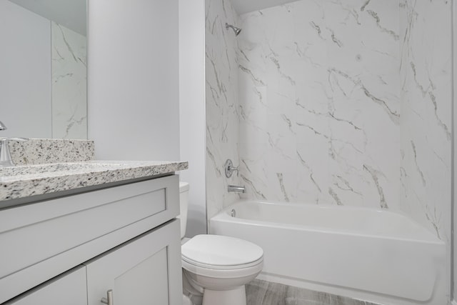 full bathroom with tiled shower / bath combo, toilet, and vanity