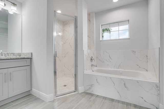 bathroom with tile floors, vanity, and plus walk in shower