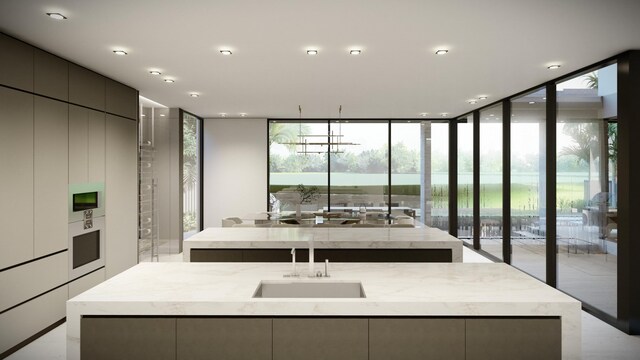 interior space with an island with sink and modern cabinets