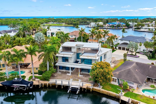 birds eye view of property featuring a residential view and a water view