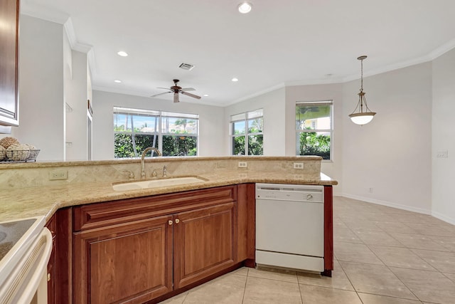 kitchen with plenty of natural light, dishwasher, light tile floors, and sink