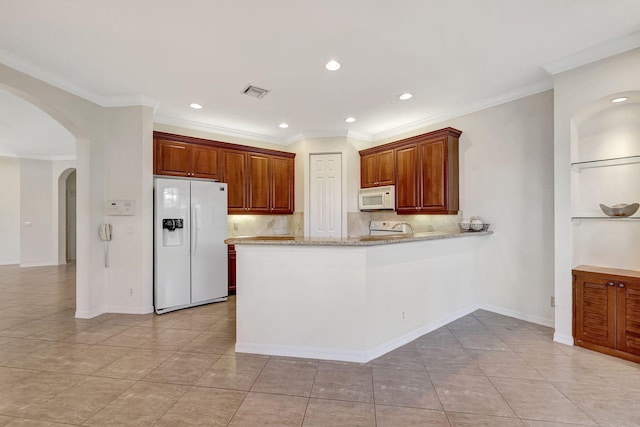 kitchen featuring backsplash, white appliances, kitchen peninsula, and light tile flooring