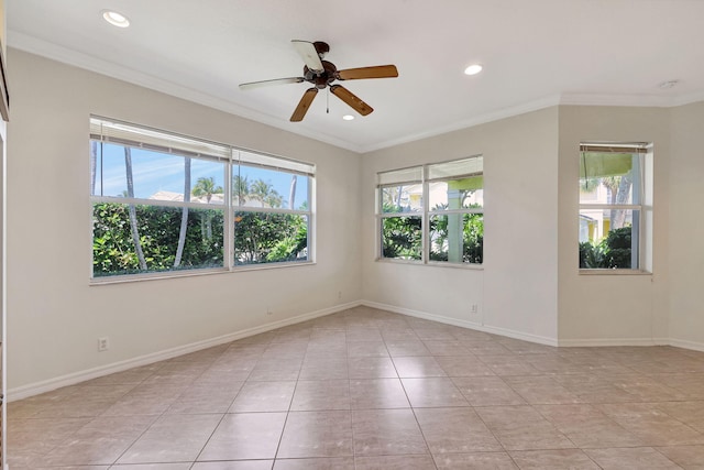 empty room with ceiling fan, a healthy amount of sunlight, light tile floors, and crown molding