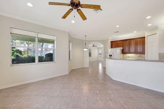 kitchen featuring pendant lighting, ceiling fan, light tile flooring, and white refrigerator with ice dispenser