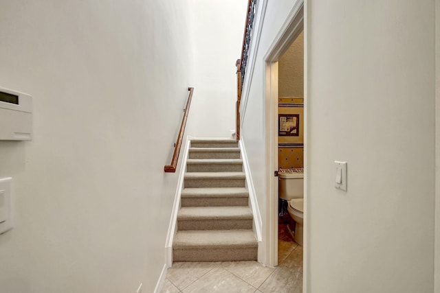 stairway with light tile flooring