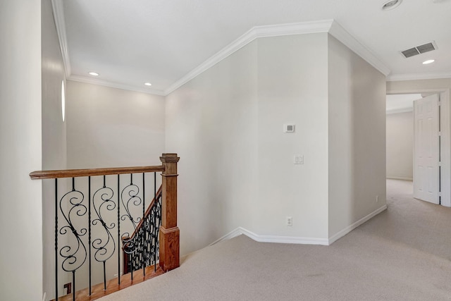 hallway featuring ornamental molding and carpet flooring