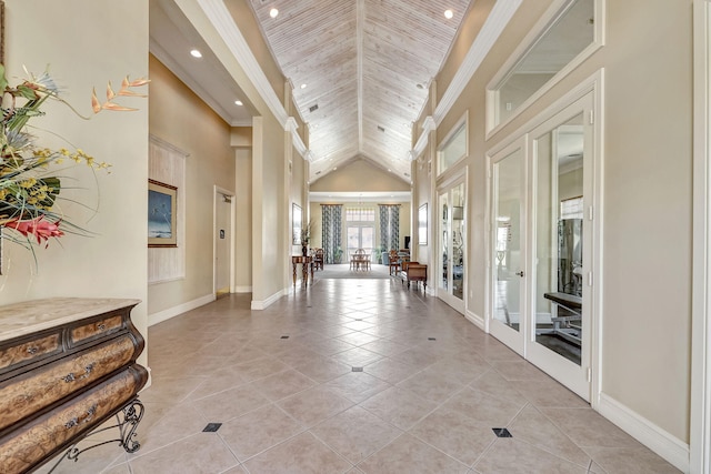 entryway featuring french doors, tile floors, high vaulted ceiling, and wooden ceiling