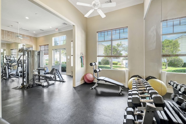 gym with ornamental molding, ceiling fan, and a wealth of natural light