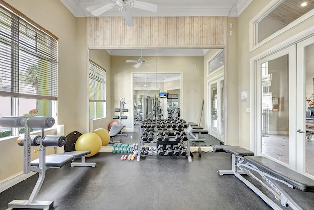 workout area with french doors, ceiling fan, and a towering ceiling