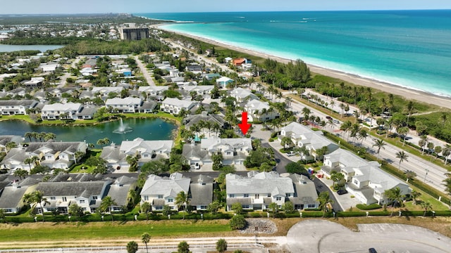 aerial view featuring a view of the beach and a water view