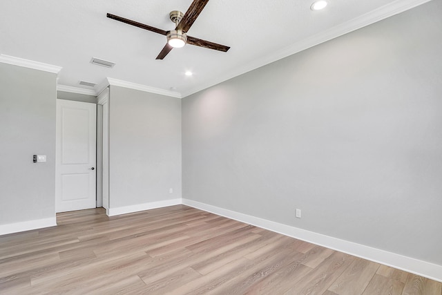 empty room featuring ceiling fan, crown molding, and light hardwood / wood-style flooring