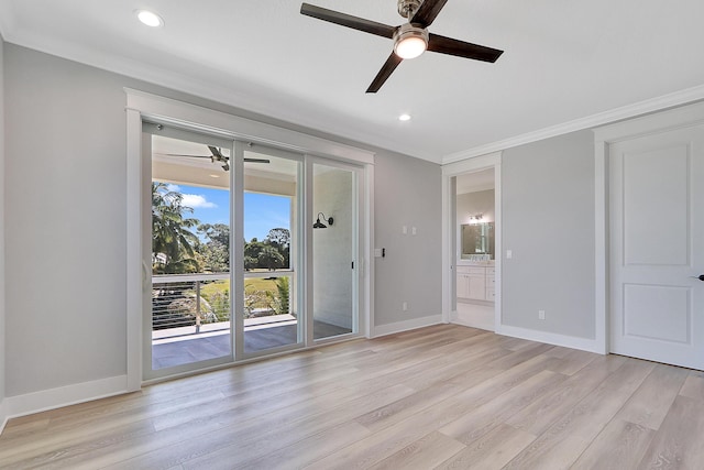 spare room with crown molding, ceiling fan, and light hardwood / wood-style floors