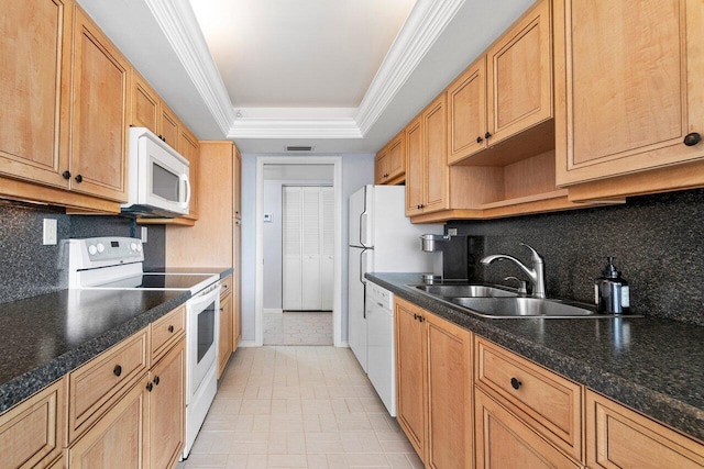 kitchen with white appliances, tasteful backsplash, sink, ornamental molding, and a tray ceiling