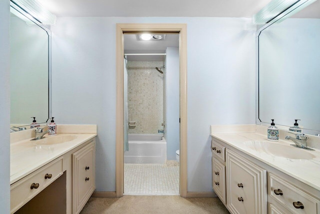 full bathroom featuring toilet, vanity, and bathtub / shower combination