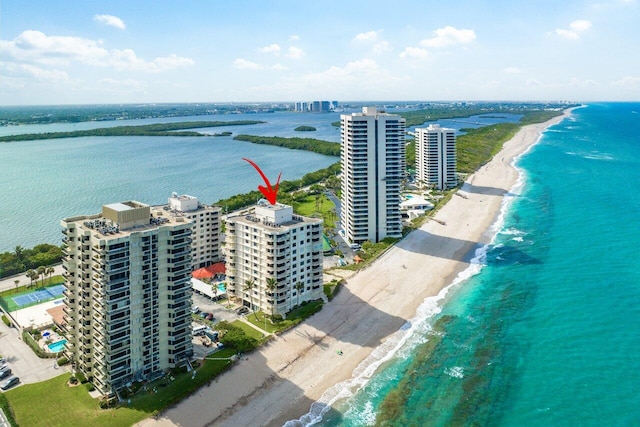 bird's eye view featuring a view of the beach and a water view