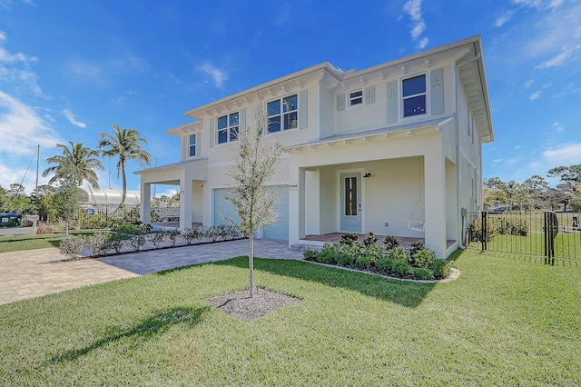 view of front of property with a garage and a front yard