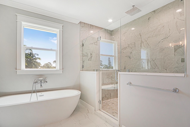 bathroom with crown molding and independent shower and bath