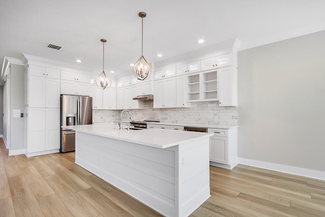 kitchen featuring pendant lighting, a center island with sink, sink, white cabinetry, and stainless steel appliances