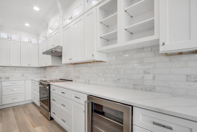 kitchen featuring white cabinetry, beverage cooler, light stone counters, electric stove, and light wood-type flooring