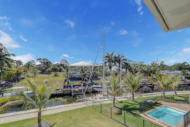 dock area featuring a water view and a yard